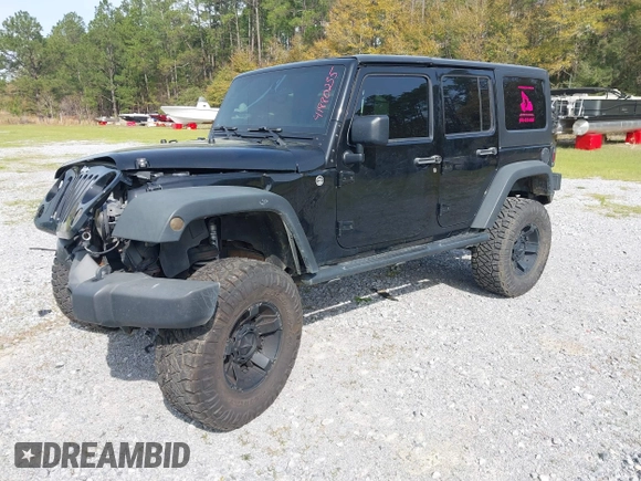 2012 Jeep Wrangler Unlimited Sport with VIN 1C4BJWDG2CL258264, listed as a IAAI auction lot 41880235 with 173,661 mi miles. Bid and sale history available at carsss.com. Image 18.