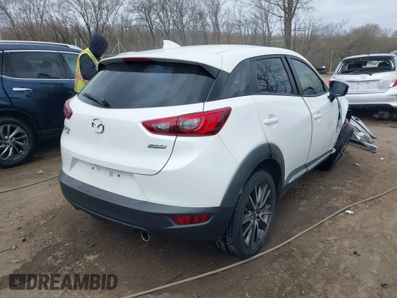 2016 Mazda CX-3 Grand Touring with VIN JM1DKFD73G0129737, listed as a IAAI auction lot 41875808 with 120,547 mi miles. Bid and sale history available at carsss.com. Image 4.