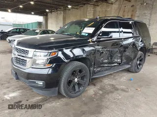 2015 Chevrolet Tahoe LT with VIN 1GNSKBKCXFR604401, listed as a IAAI auction lot 42048559 with 60,768 mi miles and . Bid and sale history available at DreamBid. Image 2.