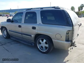 2001 Chevrolet Tahoe LS with VIN 1GNEK13T51J203013, listed as a IAAI auction lot 41886371 with 218,779 mi miles. Bid and sale history available at carsss.com. Image 3.