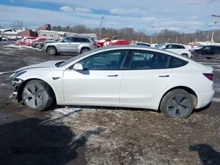 2023 Tesla Model 3 Long Range with VIN 5YJ3E1EBXPF392818, listed as a IAAI auction lot 41346835 with 31,750 mi miles and . Bid and sale history available at DreamBid. Image 14.