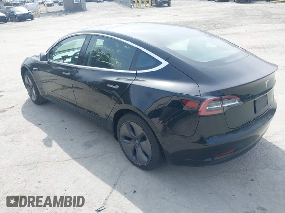 2020 Tesla Model 3 Standard Range Plus with VIN 5YJ3E1EAXLF643807, listed as a IAAI auction lot 41789406 with 49,256 mi miles. Bid and sale history available at carsss.com. Image 3.
