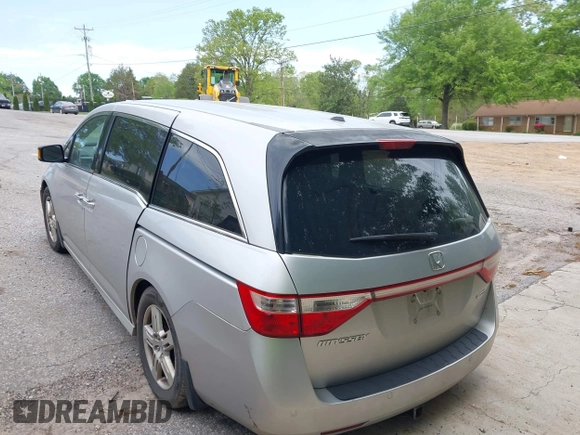 2012 Honda Odyssey Touring with VIN 5FNRL5H95CB101605, listed as a IAAI auction lot 42025163 with 286,421 mi miles. Bid and sale history available at carsss.com. Image 3.
