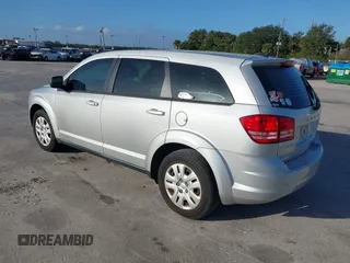 2014 Dodge Journey SE with VIN 3C4PDCAB0ET221998, listed as a IAAI auction lot 40609907 with 203,241 mi miles and . Bid and sale history available at carsss.com. Image 3.