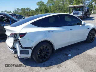 2022 Tesla Model Y Long Range with VIN 7SAYGAEE8NF431786, listed as a IAAI auction lot 41750353 with 67,846 mi miles and . Bid and sale history available at carsss.com. Image 4.