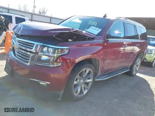 2016 Chevrolet Tahoe LTZ with VIN 1GNSKCKC9GR205745, listed as a IAAI auction lot 41710241 with 94,931 mi miles. Bid and sale history available at carsss.com. Image 2.