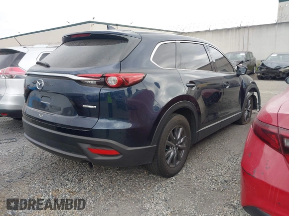 2021 Mazda CX-9 Touring with VIN JM3TCACY9M0526880, listed as a IAAI auction lot 42310923 with 25,991 mi miles and . Bid and sale history available at DreamBid. Image 4.