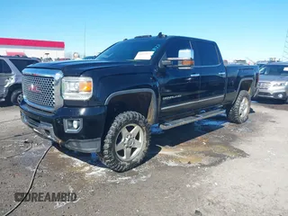 2015 GMC Sierra 2500HD available WiFi Denali with VIN 1GT120E86FF567722, listed as a IAAI auction lot 41603473 with 176,312 mi miles. Bid and sale history available at carsss.com. Image 2.