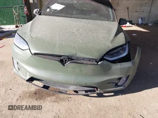 2020 Tesla Model X Long Range with VIN 5YJXCDE24LF272242, listed as a IAAI auction lot 41275226 with 103,731 mi miles. Bid and sale history available at carsss.com. Image 6.