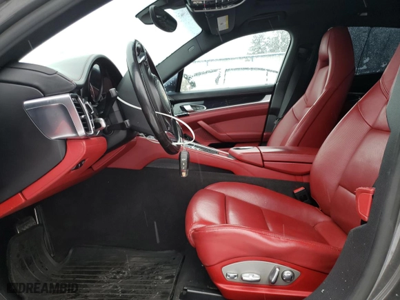 2016 Porsche Panamera 4 with VIN WP0AA2A7XGL006888, listed as a Copart auction lot 83329994 with 124,427 mi miles and Salvage Title. Bid and sale history available at carsss.com. Image 7.