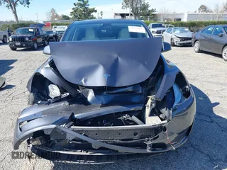 2022 Tesla Model Y Long Range with VIN 7SAYGAEEXNF381389, listed as a IAAI auction lot 41613075 with 52,800 mi miles and . Bid and sale history available at carsss.com. Image 12.