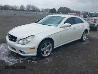 2009 Mercedes-Benz CLS-Class 5.5L with VIN WDDDJ72X79A140979, listed as a IAAI auction lot 41802317 with 195,968 mi miles. Bid and sale history available at carsss.com. Image 2.