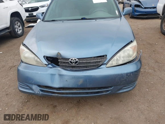 2004 Toyota Camry LE with VIN 4T1BF32K54U572537, listed as a IAAI auction lot 41850322 with 167,076 mi miles and . Bid and sale history available at DreamBid. Image 6.