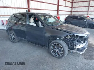 2021 BMW X1 xDrive28i with VIN WBXJG9C02M5T41170, listed as a IAAI auction lot 41886408 with 56,316 mi miles. Bid and sale history available at carsss.com. Image 1.