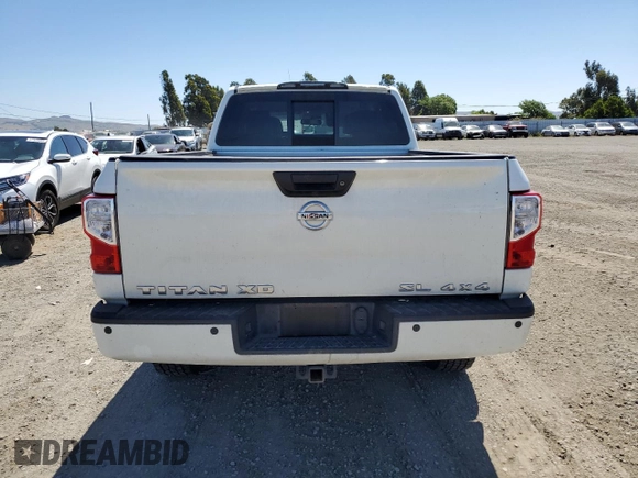 2017 Nissan Titan Pro-4X z VIN 1N6BA1F40HN559615, wystawiony jako Copart lot #57636455 z przebiegiem 99 803 mil mil oraz Szkoda całkowita • Salvage title. Historia ofert i sprzedaży dostępna na DreamBid. Obrazek 6.