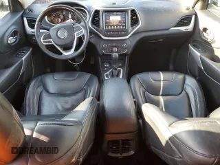 2017 Jeep Cherokee Overland with VIN 1C4PJMJS5HW665021, listed as a Copart auction lot 50872945 with 98,502 mi miles and Salvage Title. Bid and sale history available at carsss.com. Image 8.