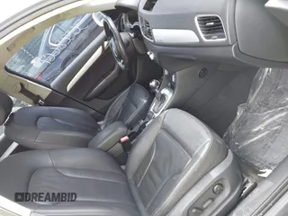 2015 Audi Q3 Premium Plus z VIN WA1EFCFS8FR001278, wystawiony jako IAAI lot #42475043 z przebiegiem 125 417 mil mil oraz . Historia ofert i sprzedaży dostępna na DreamBid. Obrazek 5.