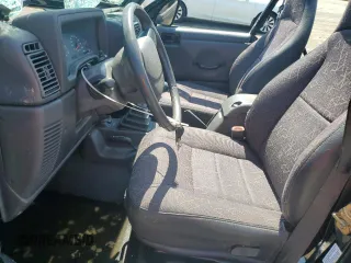2002 Jeep Wrangler Sport with VIN 1J4FA49S02P721457, listed as a Copart auction lot 61726855 with 76,191 mi miles and Salvage title. Bid and sale history available at DreamBid. Image 7.