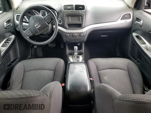 2013 Dodge Journey American Value with VIN 3C4PDCAB6DT577273, listed as a Copart auction lot 50627295 with 139,775 mi miles and Salvage title. Bid and sale history available at DreamBid. Image 8.