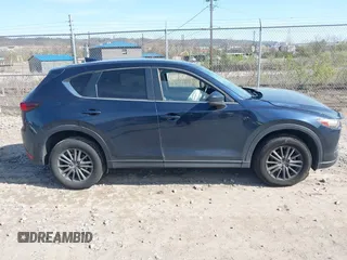 2019 Mazda CX-5 Touring with VIN JM3KFBCM8K0518806, listed as a IAAI auction lot 42038168 with 61,449 mi miles and . Bid and sale history available at DreamBid. Image 13.