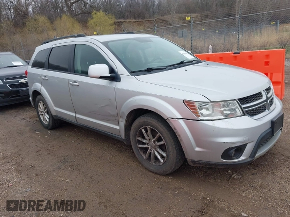2013 Dodge Journey SXT with VIN 3C4PDCBG1DT647014, listed as a IAAI auction lot 42006636 with 192,911 mi miles. Bid and sale history available at carsss.com. Image 1.