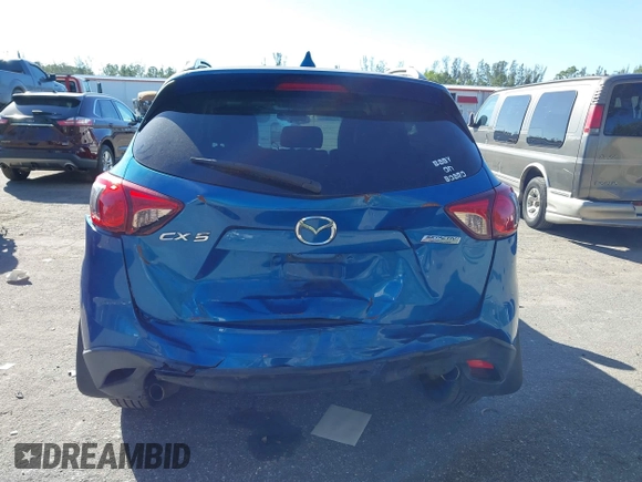 2014 Mazda CX-5 Touring with VIN JM3KE2CYXE0310873, listed as a IAAI auction lot 41309633 with 175,325 mi miles and . Bid and sale history available at DreamBid. Image 17.
