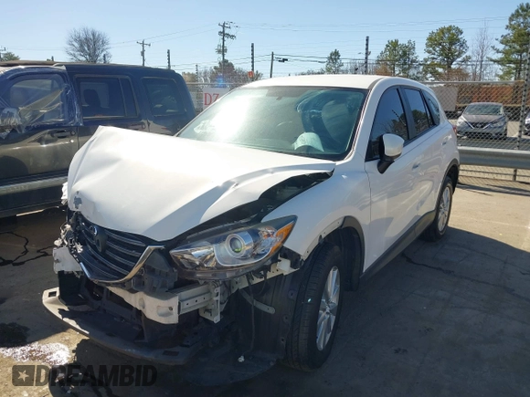 2016 Mazda CX-5 Sport with VIN JM3KE2BY9G0890587, listed as a IAAI auction lot 41685344 with 91,190 mi miles. Bid and sale history available at carsss.com. Image 2.