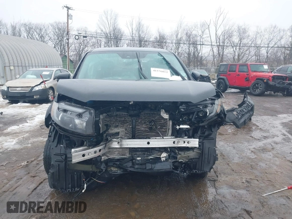 2021 Honda Ridgeline Sport with VIN 5FPYK3F12MB002877, listed as a IAAI auction lot 41576812 with 51,658 mi miles and . Bid and sale history available at DreamBid. Image 6.