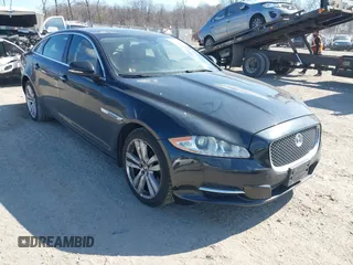 2013 Jaguar XJ Portfolio with VIN SAJWJ2GDXD8V55879, listed as a IAAI auction lot 41568366 with 121,119 mi miles and . Bid and sale history available at DreamBid. Image 1.