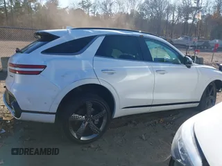 2022 Genesis GV70 Sport z VIN KMUMCDTC1NU035343, wystawiony jako IAAI lot #40788562 z przebiegiem Nie podano mil oraz . Historia ofert i sprzedaży dostępna na DreamBid. Obrazek 13.