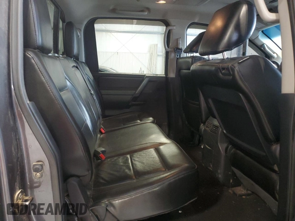 2012 Nissan Titan SL with VIN 1N6BA0ECXCN300562, listed as a Copart auction lot 58244125 with 131,595 mi miles and Salvage title. Bid and sale history available at DreamBid. Image 11.