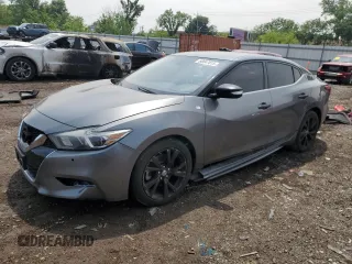 2018 Nissan Maxima SL with VIN 1N4AA6AP4JC386976, listed as a Copart auction lot 60047015 with 126,291 mi miles and Salvage title. Bid and sale history available at DreamBid. Image 1.