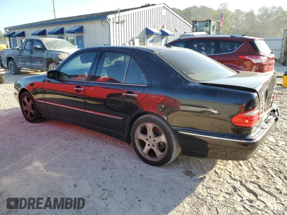 2002 Mercedes-Benz E-Class with VIN WDBJF65J32B494321, listed as a Copart auction lot 77557334 with 198,820 mi miles and Salvage Title. Bid and sale history available at carsss.com. Image 2.