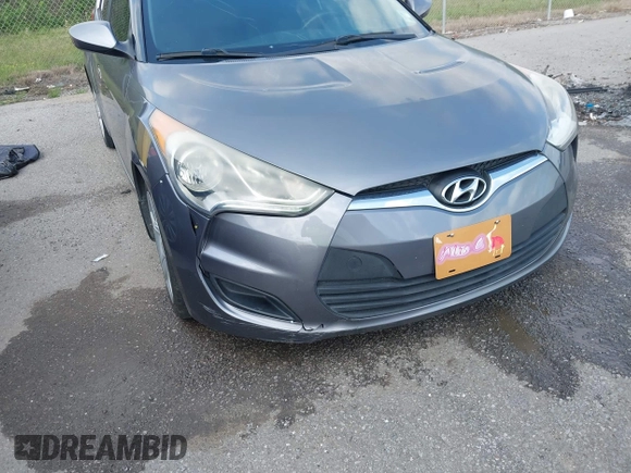 2013 Hyundai Veloster w/Black Int with VIN KMHTC6AD6DU169765, listed as a IAAI auction lot 41928516 with 130,708 mi miles and . Bid and sale history available at DreamBid. Image 6.