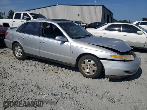 2002 Saturn LS z VIN 1G8JW54RX2Y510735, wystawiony jako Copart lot #67517484 z przebiegiem 272 600 mil mil oraz Szkody całkowita. Historia ofert i sprzedaży dostępna na DreamBid. Obrazek 4.