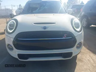 2021 MINI Hardtop 4 Door Cooper S with VIN WMWXU9C00M2P04693, listed as a IAAI auction lot 41785185 with 57,848 mi miles and . Bid and sale history available at DreamBid. Image 12.