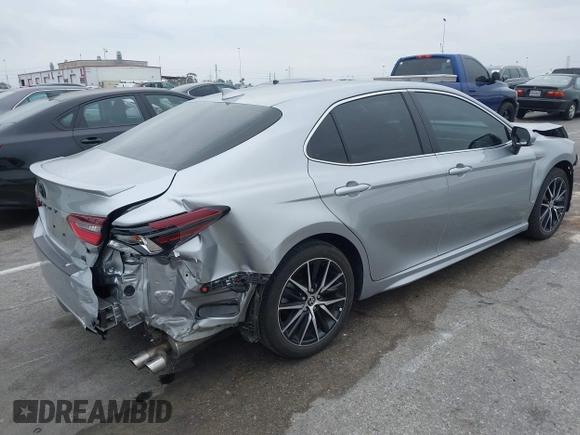 2023 Toyota Camry SE with VIN 4T1G11AKXPU809876, listed as a IAAI auction lot 42100546 with 35,055 mi miles and . Bid and sale history available at DreamBid. Image 4.