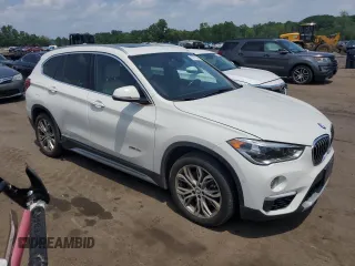 2017 BMW X1 xDrive28i with VIN WBXHT3Z3XH4A55624, listed as a Copart auction lot 59773545 with 140,251 mi miles and Salvage title. Bid and sale history available at DreamBid. Image 4.