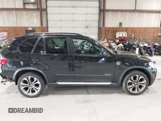 2012 BMW X5 50i with VIN 5UXZV8C50CL425721, listed as a IAAI auction lot 42590676 with 192,355 mi miles and . Bid and sale history available at DreamBid. Image 13.