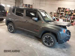 2017 Jeep Renegade Trailhawk z VIN ZACCJBCB5HPG55800, wystawiony jako IAAI lot #40960129 z przebiegiem 83 728 mil mil oraz . Historia ofert i sprzedaży dostępna na DreamBid. Obrazek 1.