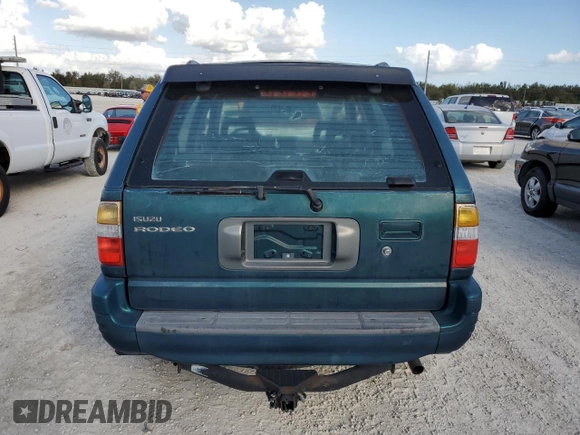 1999 Isuzu Rodeo S with VIN 4S2CK58W0X4378100, listed as a Copart auction lot 78462184 with Not provided miles and Salvage title. Bid and sale history available at DreamBid. Image 6.