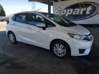 2016 Honda Fit LX with VIN JHMGK5H58GX031938, listed as a Copart auction lot 63101705 with 102,138 mi miles and Salvage title. Bid and sale history available at DreamBid. Image 4.