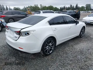 2017 Mazda 6 Grand Touring with VIN JM1GL1X51H1142473, listed as a IAAI auction lot 42234809 with 101,633 mi miles and . Bid and sale history available at DreamBid. Image 4.