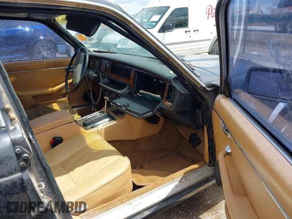 1982 Jaguar XJ with VIN SAJAV1248CC341050, listed as a IAAI auction lot 42653594 with Not provided miles and . Bid and sale history available at DreamBid. Image 5.