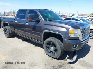 2015 GMC Sierra 2500HD Denali z VIN 1GT120E89FF506980, wystawiony jako IAAI lot #41870099 z przebiegiem 207 012 mil mil oraz . Historia ofert i sprzedaży dostępna na DreamBid. Obrazek 1.