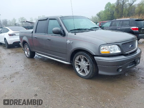 2002 Ford F-150 Harley Davidson with VIN 1FTRW07392KD29874, listed as a IAAI auction lot 41974230 with 163,279 mi miles. Bid and sale history available at carsss.com. Image 1.