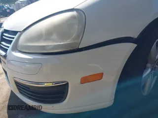 2009 Volkswagen Jetta z VIN 3VWTZ71K39M286381, wystawiony jako IAAI lot #42126439 z przebiegiem 138 297 mil mil oraz . Historia ofert i sprzedaży dostępna na DreamBid. Obrazek 6.