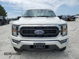 2023 Ford F-150 XL with VIN 1FTFW1E85PKG17275, listed as a Copart auction lot 57497155 with 34,379 mi miles and Salvage title. Bid and sale history available at DreamBid. Image 5.