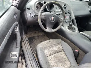 2006 Pontiac Solstice z VIN 1G2MB33B56Y000343, wystawiony jako Copart lot #74567004 z przebiegiem Nie podano mil oraz Szkoda całkowita • Salvage title. Historia ofert i sprzedaży dostępna na DreamBid. Obrazek 8.