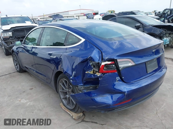 2019 Tesla Model 3 Mid Range with VIN 5YJ3E1EA5KF190453, listed as a IAAI auction lot 41880684 with 58,909 mi miles and . Bid and sale history available at carsss.com. Image 3.